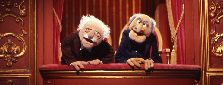 Muppet Show's Statler and Waldorf looking down from their balcony